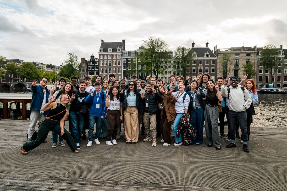 The accelerator cohort on a canal-side quay in Amsterdam